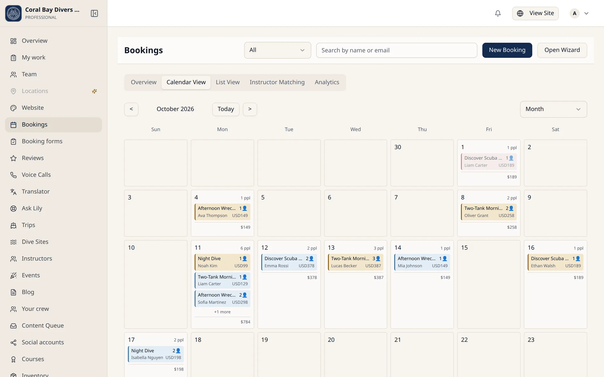 The bookings calendar in the DiveConnect dashboard, showing a month of dive trips with the divers and amounts on each day.